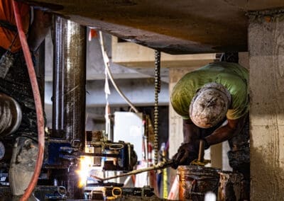 A Pacific Foundation welder prepares the next section of micropile casing at the CAMS III project at the Oregon State Capitol