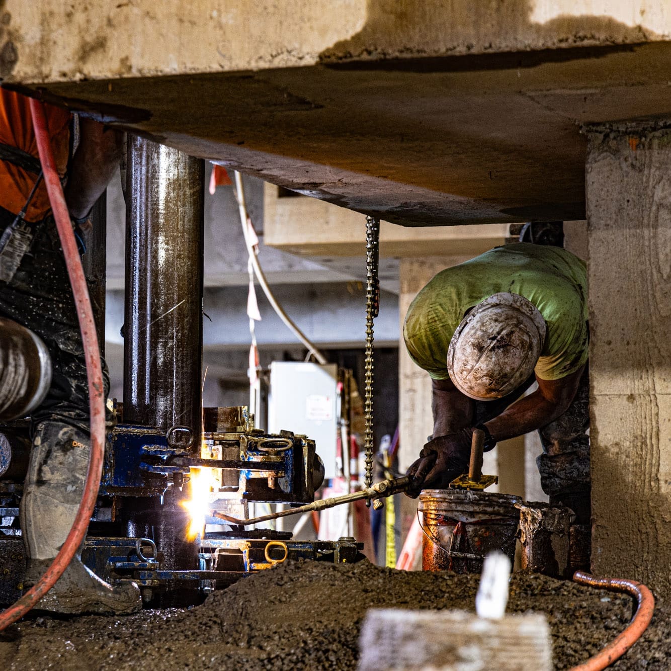 A Pacific Foundation welder prepares the next section of micropile casing at the CAMS III project at the Oregon State Capitol