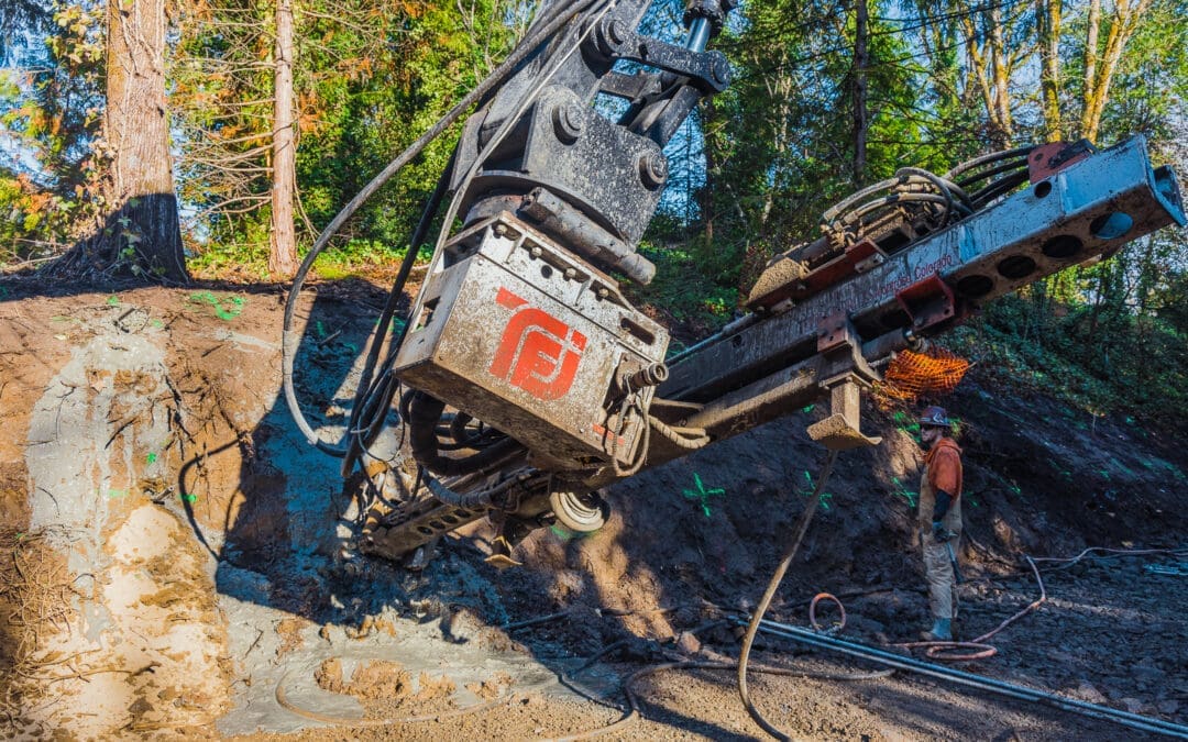 A TEI Rock Drill works at a wooded location in Oregon