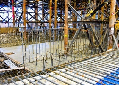 New concrete is being poured for a new basement cafeteria beneath the Oregon State Capitol