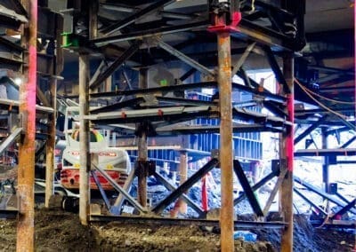 Steel towers and micropiles support a building undergoing seismic upgrades